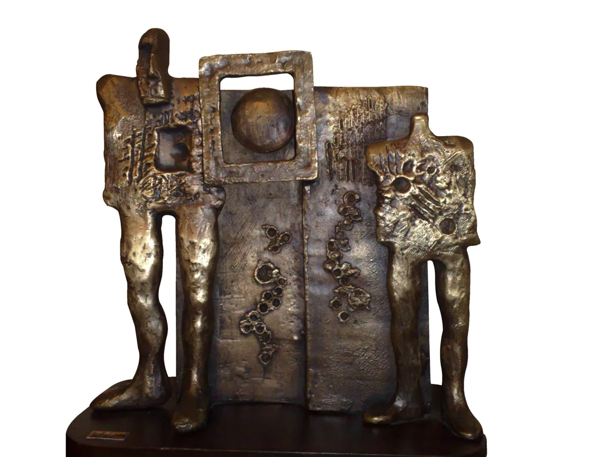 Bronze A15, 2007–2008. Bronze. Textured bronze of two standing figures on either side of a panel with a framed circle.