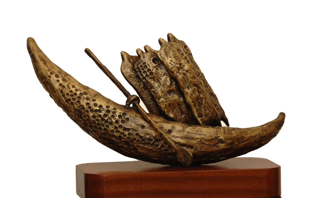 Bronze A2, 2007–2008. Bronze. Textured bronze of a crescent boat carrying a group of figures and an oar, on a wooden base.