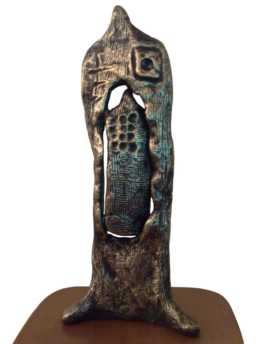 Bronze A5, 2007–2008. Bronze. Tall bronze form with a niche containing a patterned, tablet-like panel, on a wooden base.