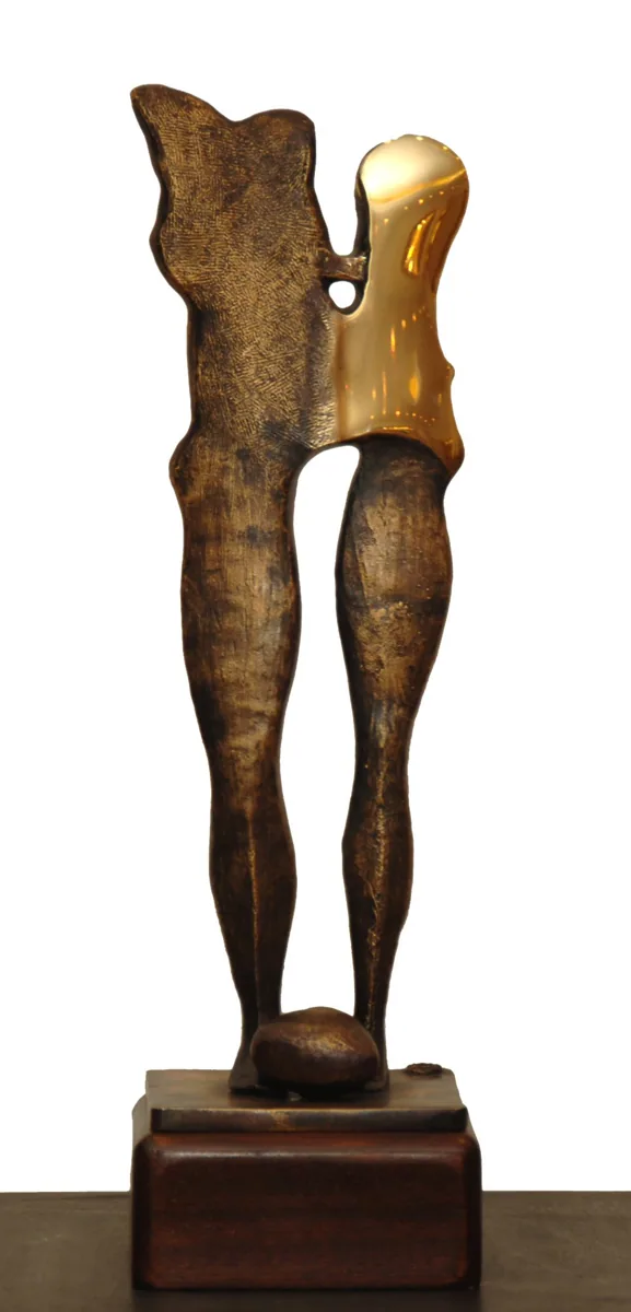 Bronze B19, 2009–2010. Bronze. Bronze of a tall figure with long legs beside a polished gold, flag-like form, on a wooden base.