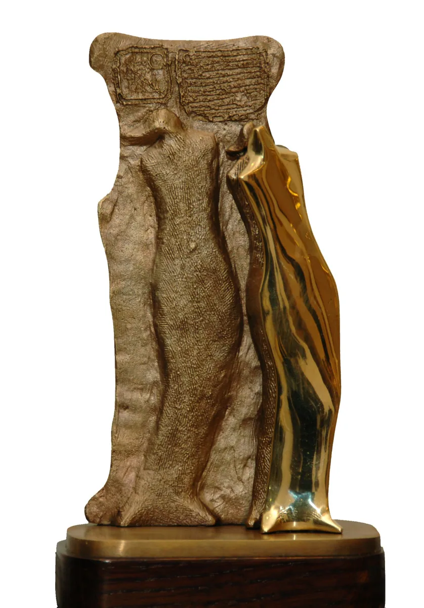 Bronze B25, 2009–2010. Bronze. Bronze of a tall textured slab with a polished gold figure emerging from its side, on a wooden base.