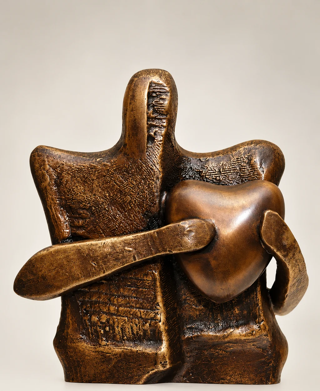 Big Heart, 2009. Bronze, wood base. Bronze of a seated figure merged with a rounded, rock-like form, on a wooden base.